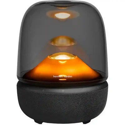 اسپیکر بلوتوثی هارمن کاردن مدل Harman Kardon Aura Studio 5 با درخشش کهربایی اسپیکر بلوتوثی هارمن کاردن مدل Harman Kardon Aura Studio 5 در گالری اول با نور نارنجی