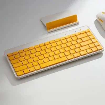 نسخه زرد کیبورد قابل حمل Xiaomi MXBXJP01YM روی میز کیبورد زرد شیائومی MXBXJP01YM با پایه تبلت